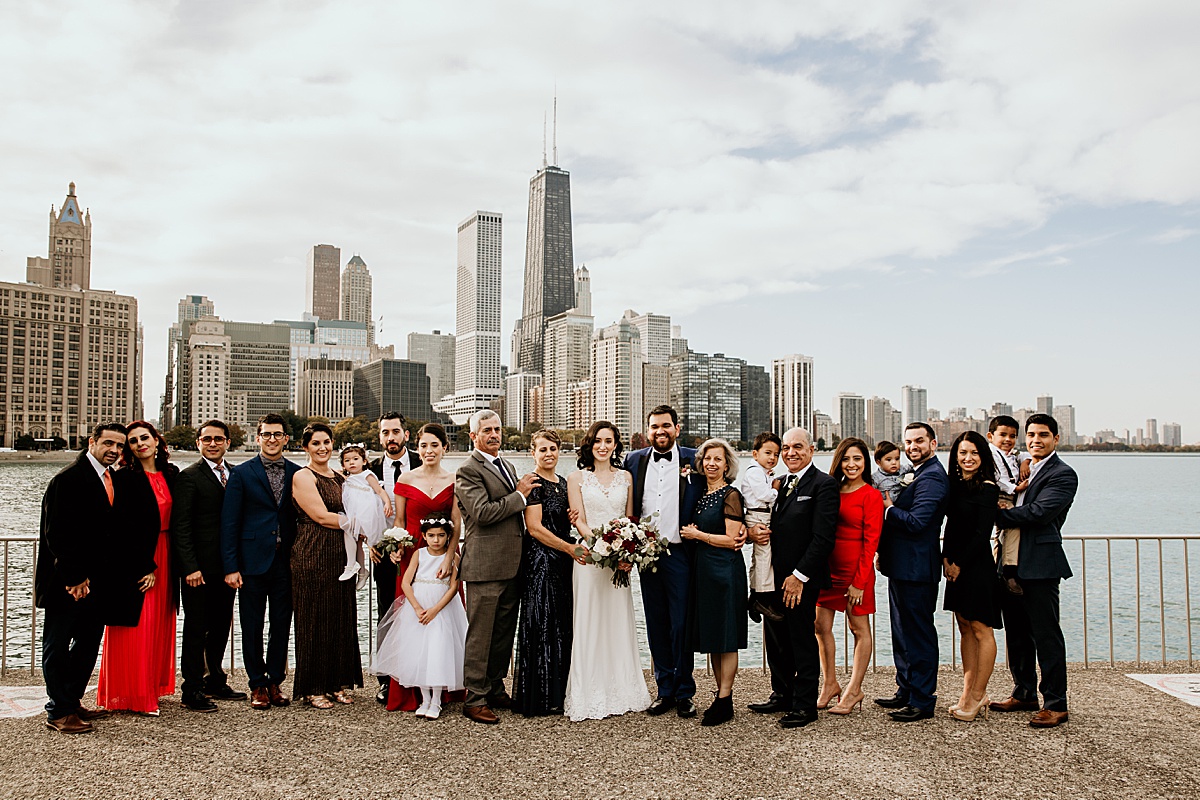 Big family wedding portrait in front of the chicago skyline.