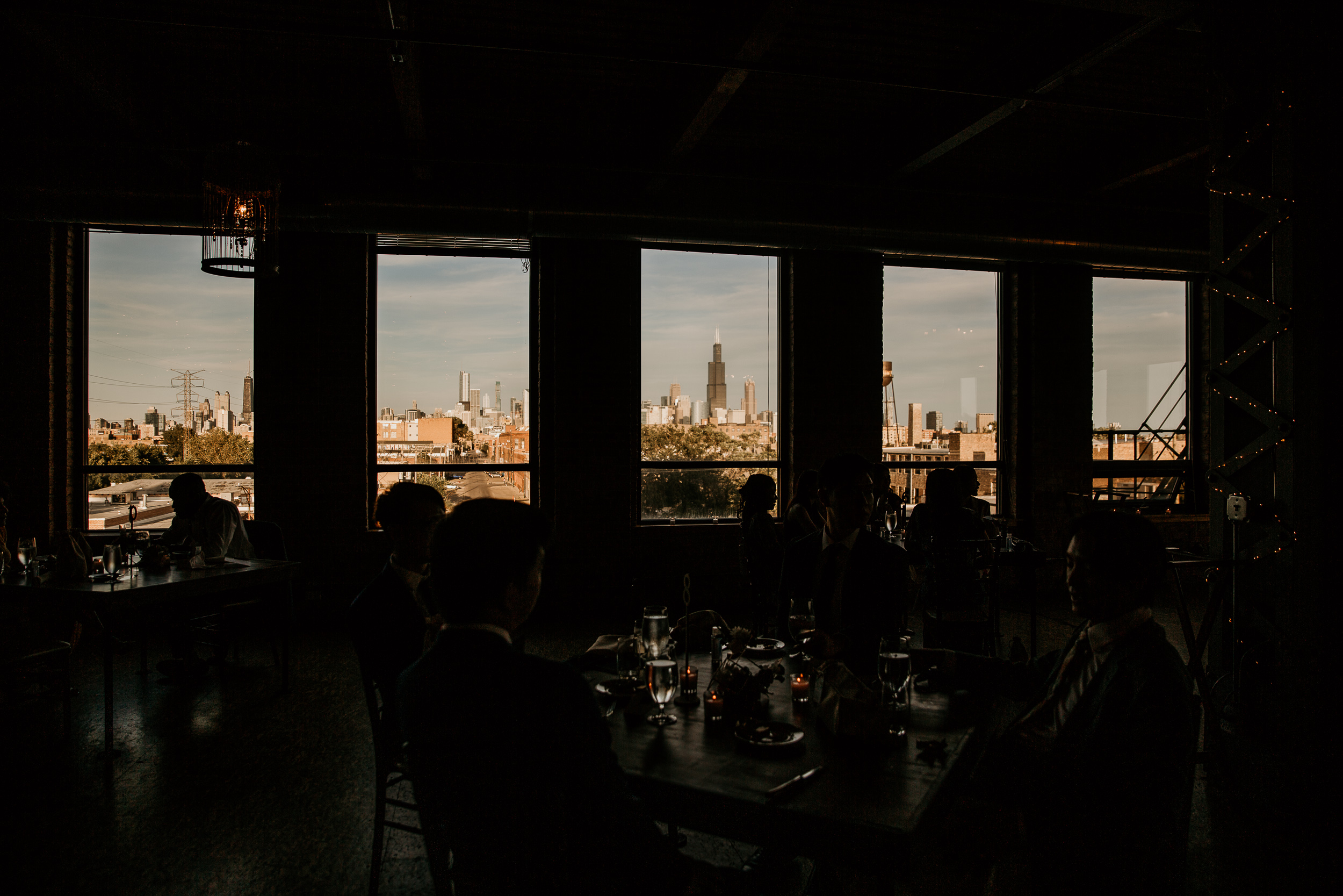 view of chicago skyline at sunset from industrial wedding loft reception