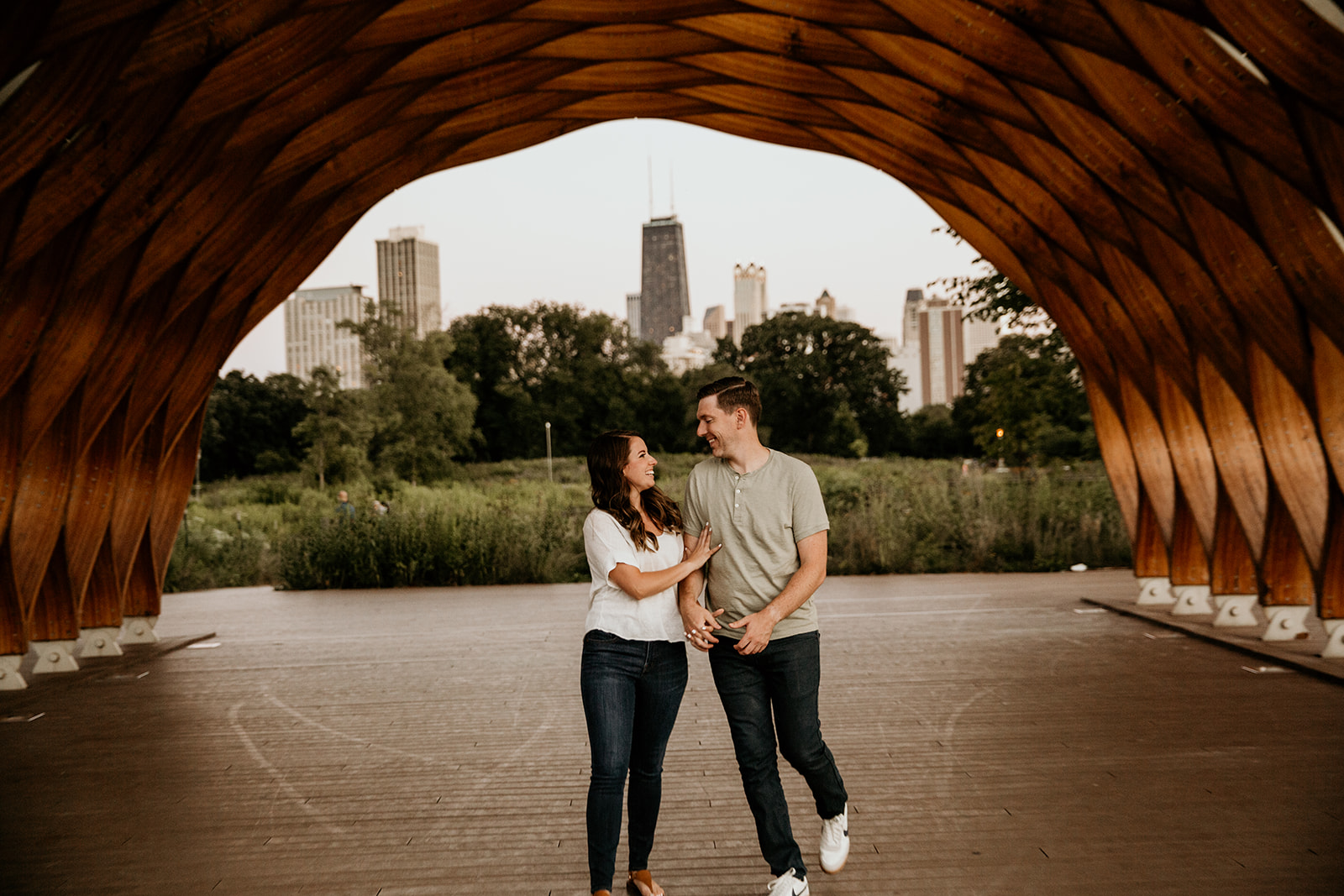 Couple walking and laughing together at Lincoln Park Board Walk