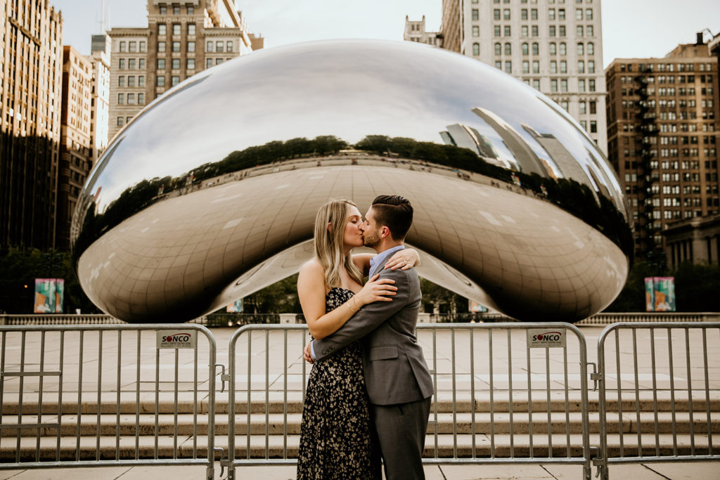 Couple kissing in front of the bean in Chicago