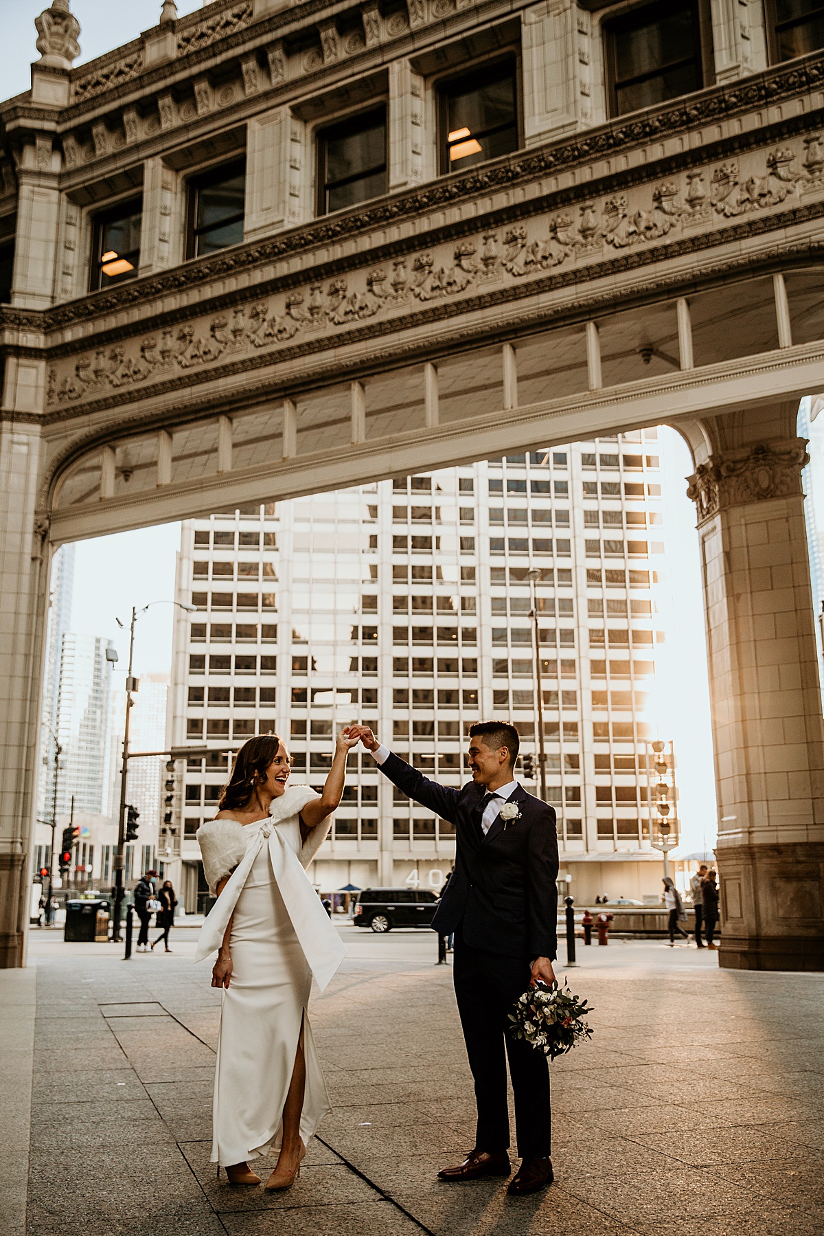 bride and groom dancing at the Wrigley building in chicago