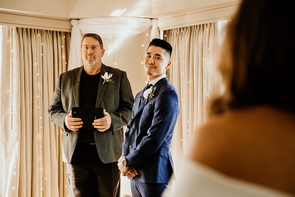 groom seeing his bride for the first time at the alter