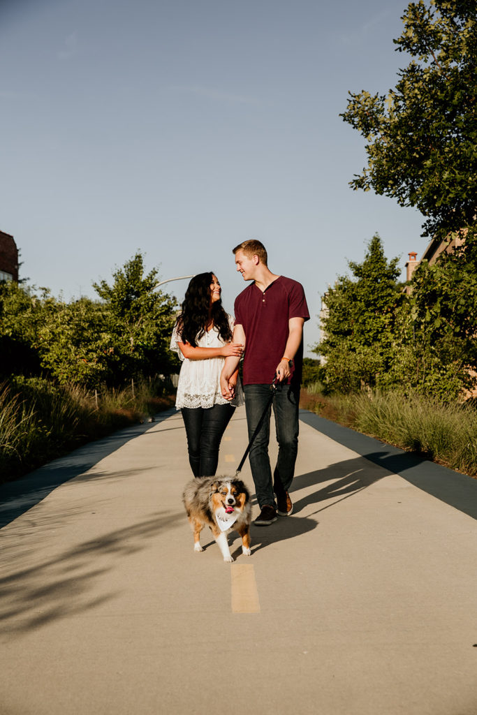 Couple's engagement photos walking on the 606 trail of chicago