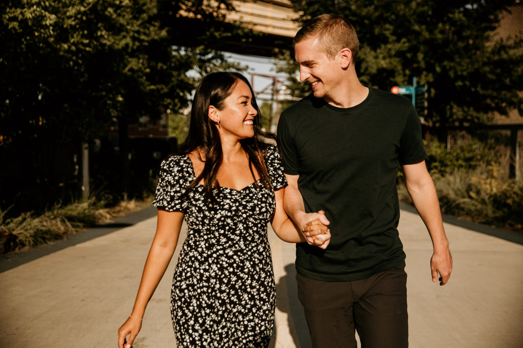 Couple's engagement photos walking on the 606 trail of chicago