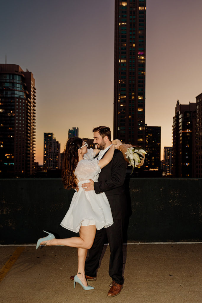 Couple's engagement photos on a city parking garage rooftop of chicago
