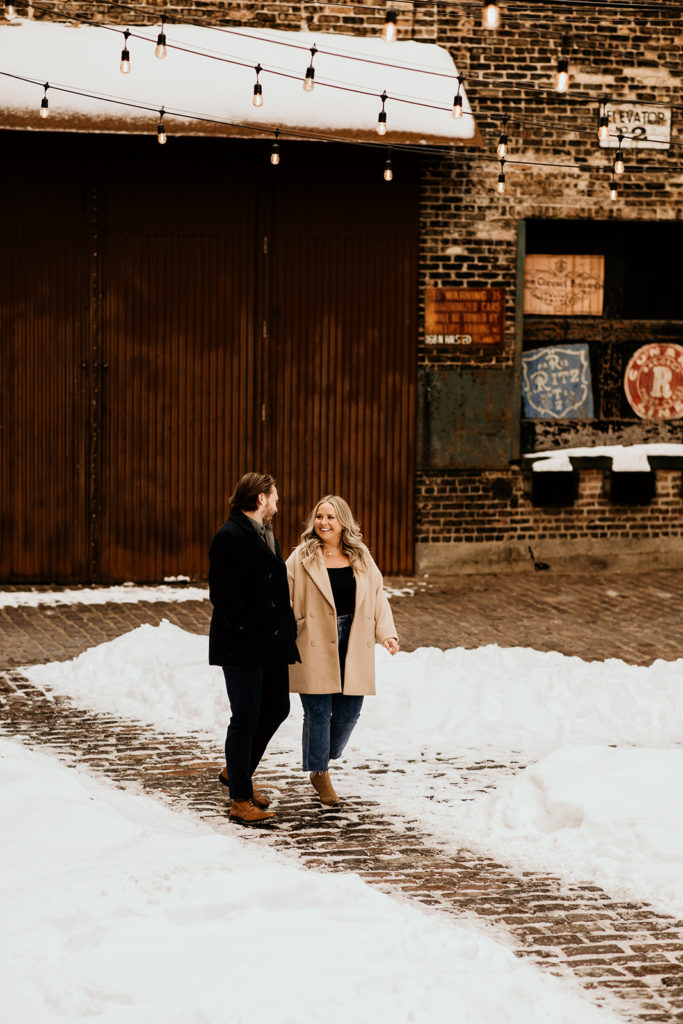 Couple's engagement photos in the alley way behind green street smokes meets in the. west loop of chicago
