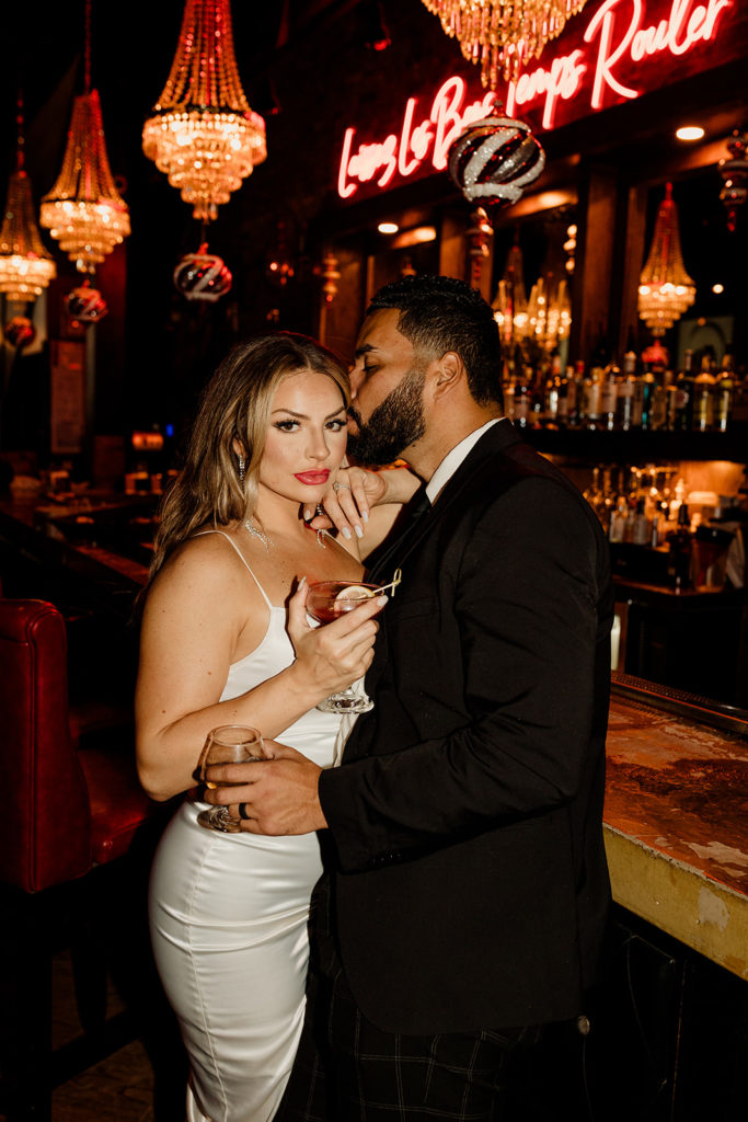 engaged couple having drinks at chicago bar at night