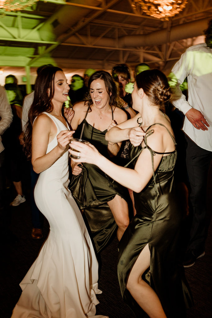 wedding reception with bridesmaids on the dance floor 