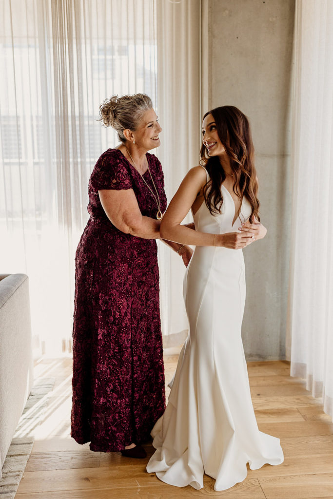 bride and mother getting ready for wedding