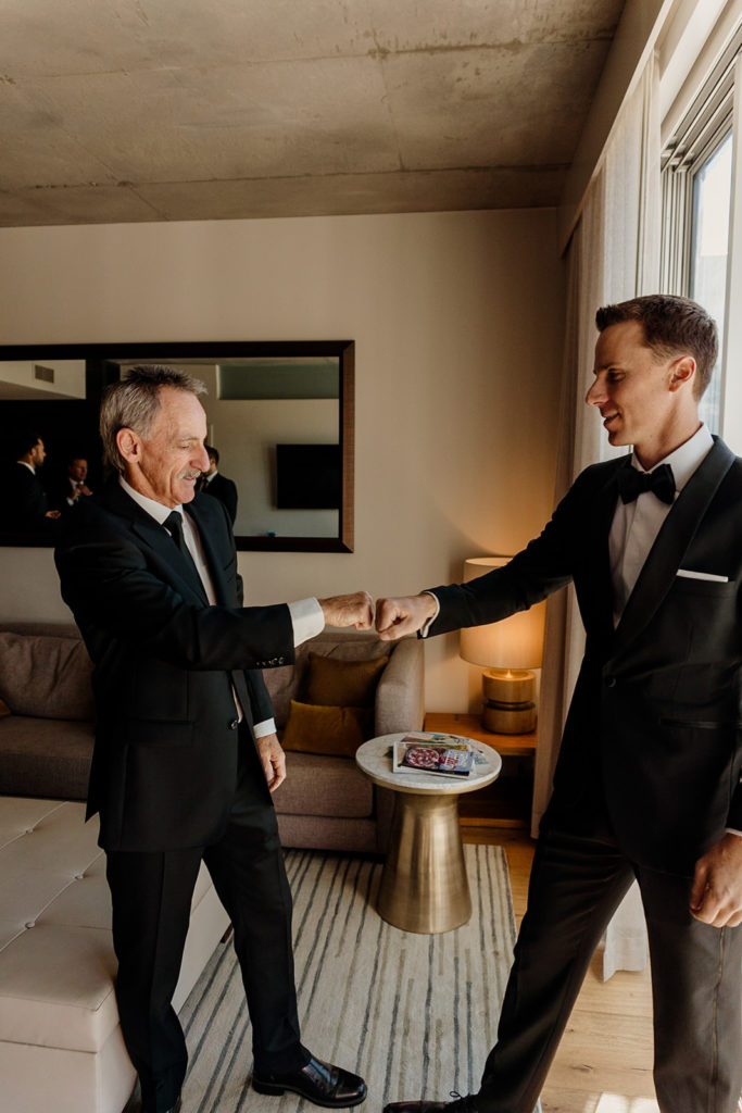 groom and father getting ready for wedding
