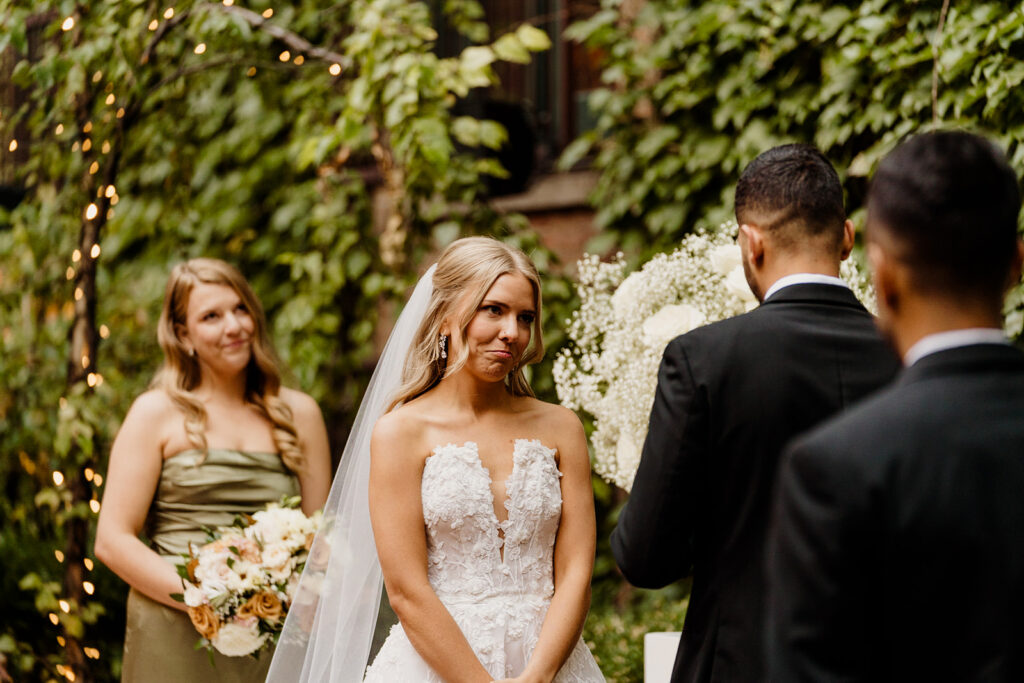 bride reaction during wedding ceremony vows