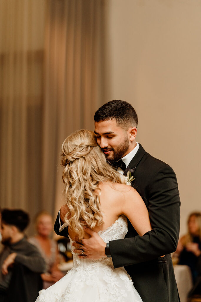 bride and groom first dance at wedding reception